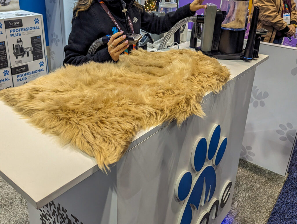 Demo of the furMe Grooming Vacuum on a tan furry rug