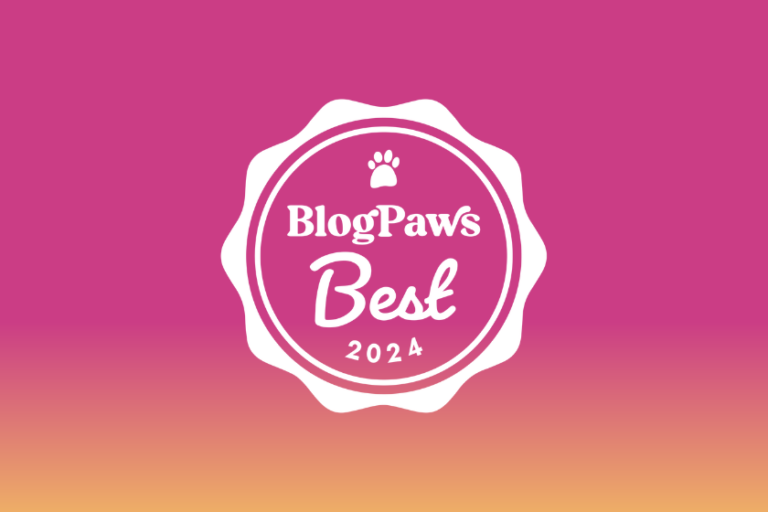 White BlogPaws Best Award Badge on pink and orange ombre background