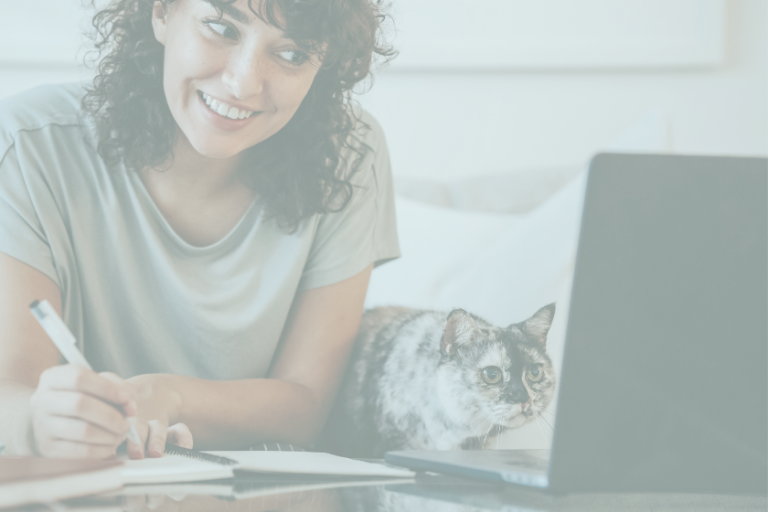 Woman at desk with cat and computer | What are lead magnets