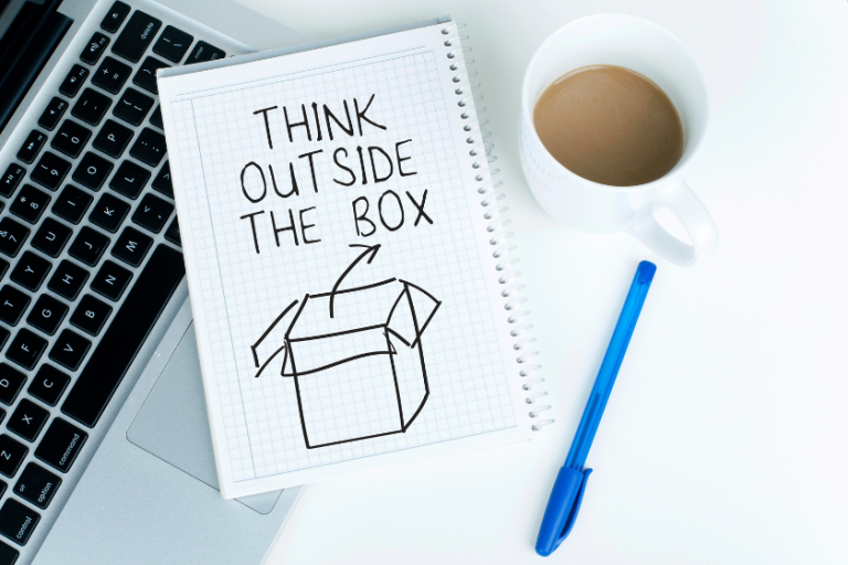 think outside the box doodle on notebook | Learn How to Balance Creative Freedom with Discipline