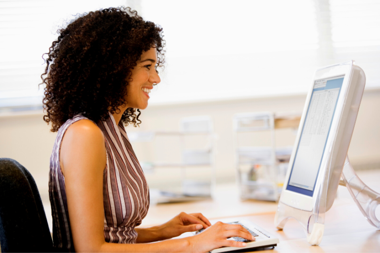 woman typing on computer | 5 Tips to Leverage Storytelling in Email Marketing